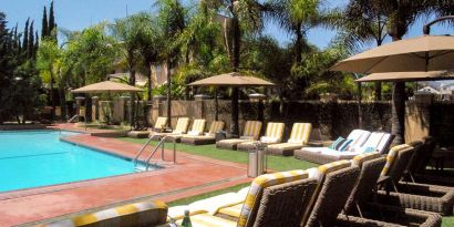 Pool area with lounges at Hollywood Hotel.