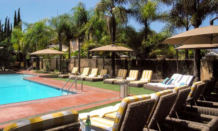 Pool area with lounges at Hollywood Hotel.