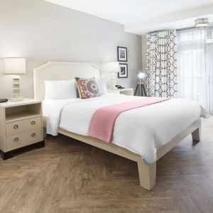 Queen bedroom with desk at Hollywood Hotel.