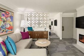 Living room with fireplace in a hotel suite at Le Parc.