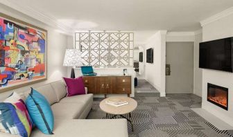 Living room with fireplace in a hotel suite at Le Parc.