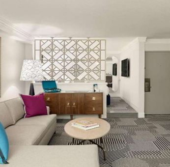 Living room with fireplace in a hotel suite at Le Parc.