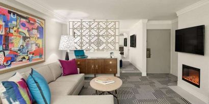 Living room with fireplace in a hotel suite at Le Parc.