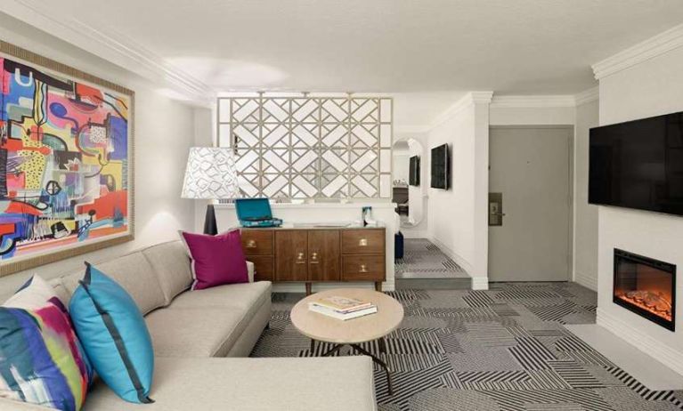 Living room with fireplace in a hotel suite at Le Parc.