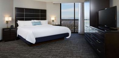 Bright and comfortable king bedroom at Embassy Suites By Hilton LAX Airport North.