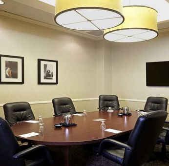 Meeting room wirh small table at Embassy Suites By Hilton LAX Airport North.