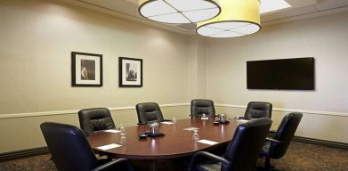 Meeting room wirh small table at Embassy Suites By Hilton LAX Airport North.