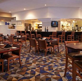 Dining area suitable for co-working at Embassy Suites By Hilton LAX Airport North.