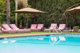 Outdoor seating area by the pool at Hollywood Hotel.