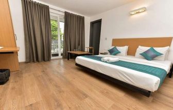 spacious delux king room with outdoor terrace at Hotel Luxury Stay.