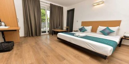 spacious delux king room with outdoor terrace at Hotel Luxury Stay.