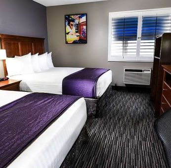 Hotel room with 2 queen beds at Best Western McCarran Inn.