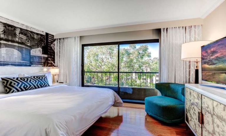 King bedroom with big window at Avenue Of The Arts Hotel.