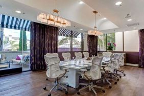 Bright meeting room with windows at Avenue Of The Arts Hotel.