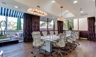 Bright meeting room with windows at Avenue Of The Arts Hotel.