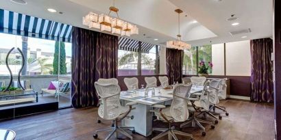 Bright meeting room with windows at Avenue Of The Arts Hotel.