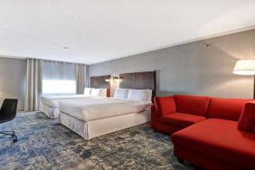 Twin room with L sofa at Four Points By Sheraton Toronto Mississauga.