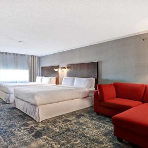 Twin room with L sofa at Four Points By Sheraton Toronto Mississauga.