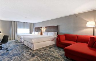 Twin room with L sofa at Four Points By Sheraton Toronto Mississauga.