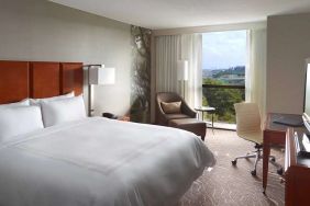 Bright king bedroom with window and workstation at Atlanta Marriott Northwest At Galleria.