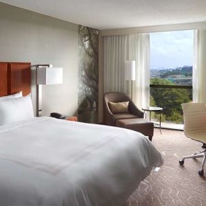 Bright king bedroom with window and workstation at Atlanta Marriott Northwest At Galleria.