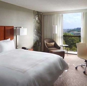 Bright king bedroom with window and workstation at Atlanta Marriott Northwest At Galleria.