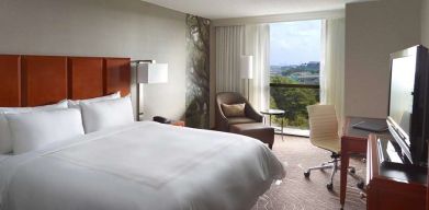 Bright king bedroom with window and workstation at Atlanta Marriott Northwest At Galleria.