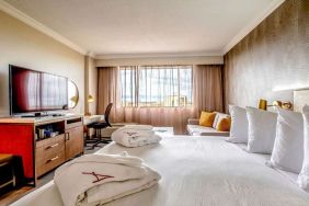 Hotel room with desk and TV screen at Atlantica Hotel Halifax.