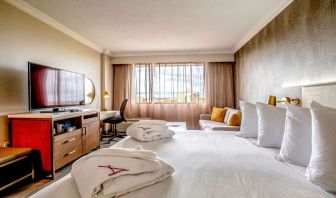 Hotel room with desk and TV screen at Atlantica Hotel Halifax.