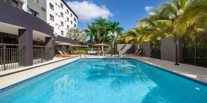 Refreshing outdoor pool at Courtyard Miami Dolphin Mall.