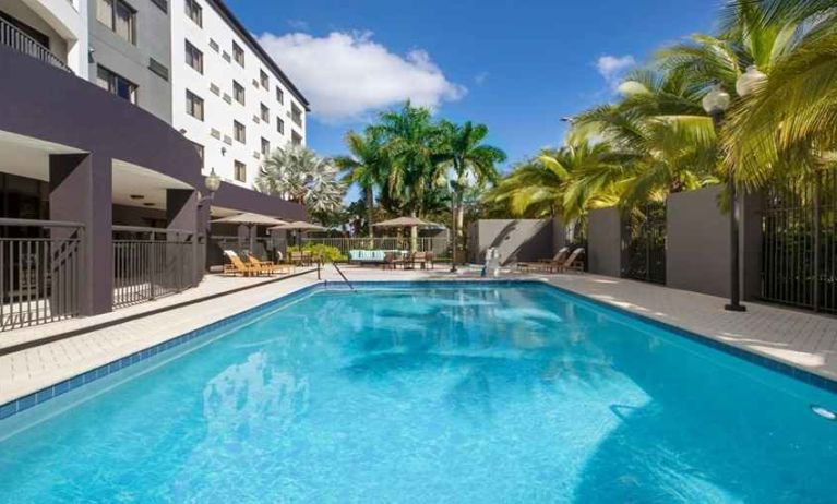 Refreshing outdoor pool at Courtyard Miami Dolphin Mall.