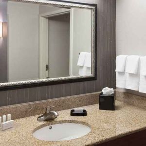 Guest bathroom with shower at Courtyard Miami Dolphin Mall.