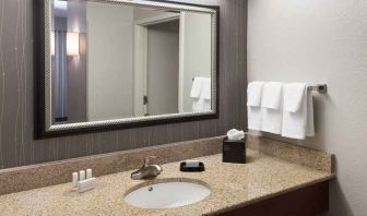 Guest bathroom with shower at Courtyard Miami Dolphin Mall.