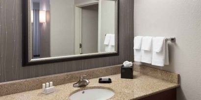 Guest bathroom with shower at Courtyard Miami Dolphin Mall.