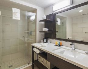 Clean and spacious guest bathroom with shower at Southbank Hotel Jacksonville Riverwalk.
