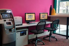 Well equipped business center with PC, internet, and printer at Courtyard By Marriott New York JFK Airport.