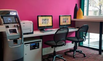 Well equipped business center with PC, internet, and printer at Courtyard By Marriott New York JFK Airport.