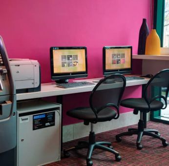 Well equipped business center with PC, internet, and printer at Courtyard By Marriott New York JFK Airport.