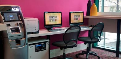 Well equipped business center with PC, internet, and printer at Courtyard By Marriott New York JFK Airport.