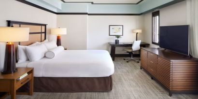 Spacious delux king room with TV and business desk at The Ambrose Hotel Santa Monica.