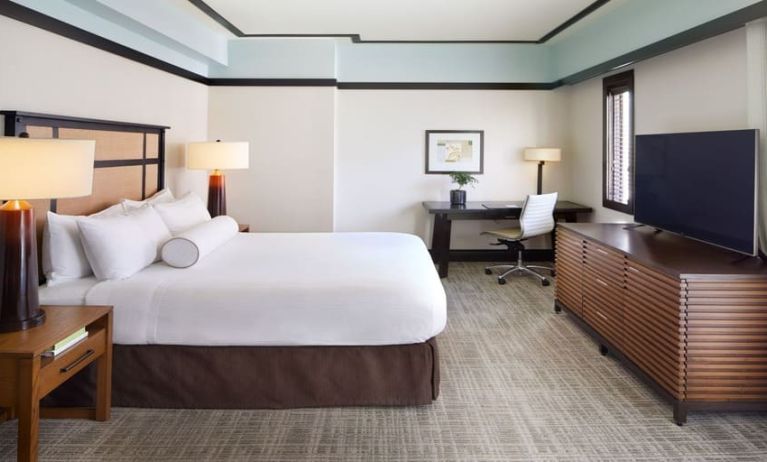 Spacious delux king room with TV and business desk at The Ambrose Hotel Santa Monica.