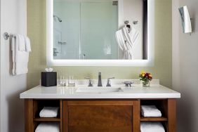 Guest bathroom with shower at The Ambrose Hotel Santa Monica.