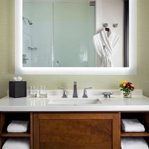 Guest bathroom with shower at The Ambrose Hotel Santa Monica.