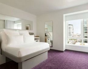 Comfortable king room with lots of natural light at Yotel Boston.