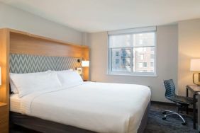 Lovely king bedroom with business desk at Holiday Inn Wall Street.