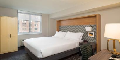 Comfortable delux king room with work station at Holiday Inn Wall Street.