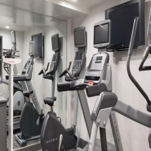 Well equipped fitness center with treadmills at Holiday Inn Wall Street.