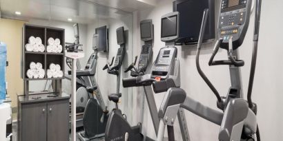 Well equipped fitness center with treadmills at Holiday Inn Wall Street.