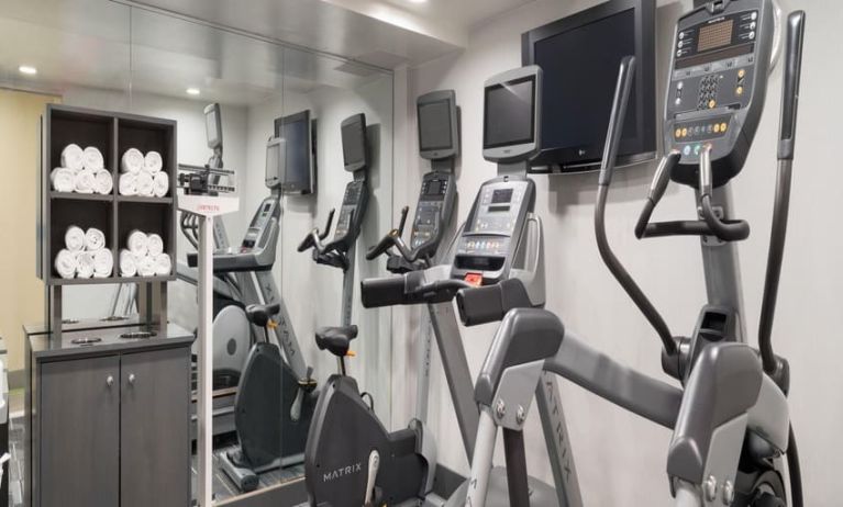 Well equipped fitness center with treadmills at Holiday Inn Wall Street.