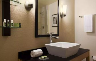 Private guest bathroom with shower at Cambria Hotel Miami Airport - Blue Lagoon.